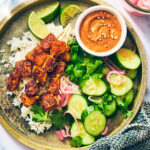 Vegan Satay Tofu Skewers with peanut sauce and quick pickled shallots.