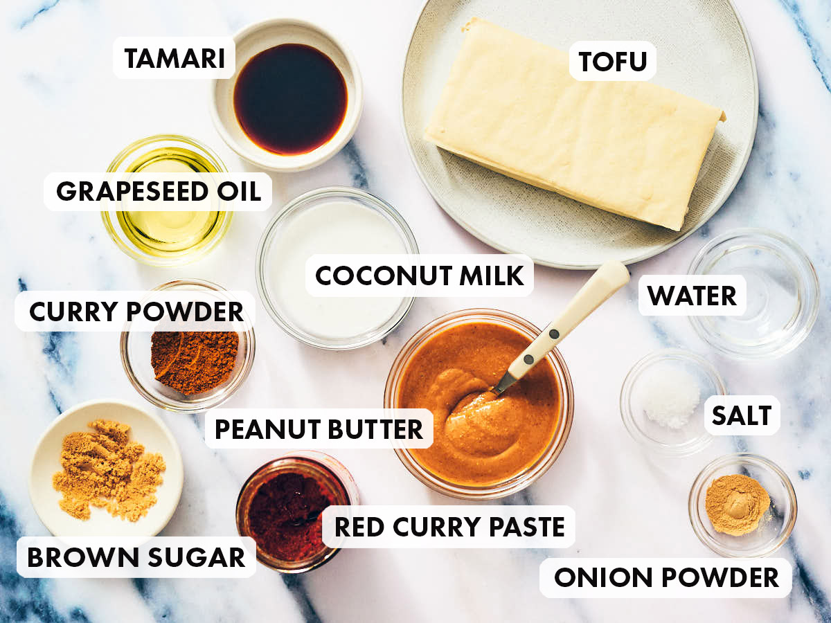 Ingredients to make Vegan Satay , including tofu, peanut butter, curry paste, and coconut milk. 