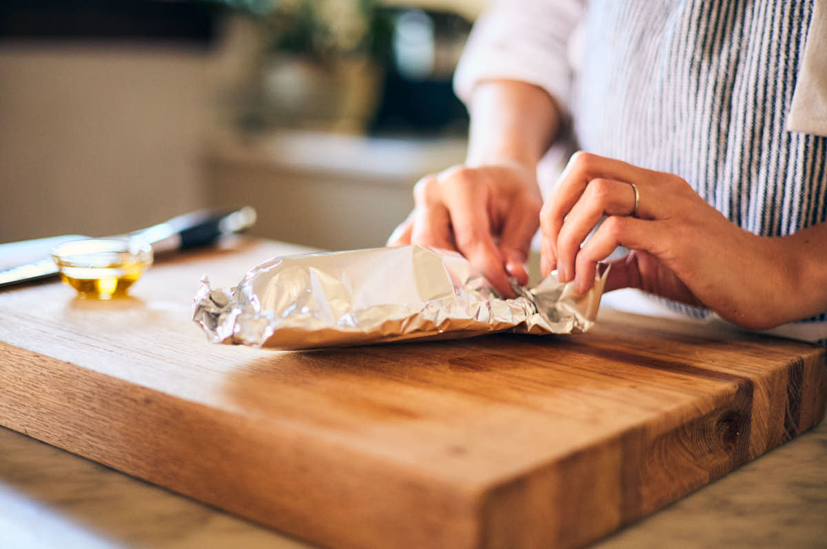 Wrapping beets in a foil packet before roasting in an air fryer.