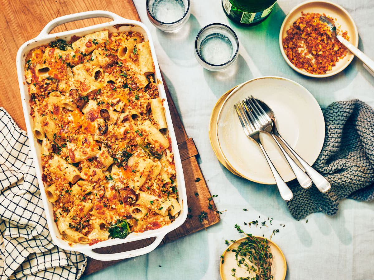 Butternut Squash Baked Pasta in a casserole dish on a dinner table.