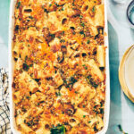 Cheesy Butternut Squash Pasta bake with kale and mushrooms in casserole dish.