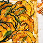 Vegetarian Roasted Squash Tart with Feta, Hot Honey, and Fried Sage.
