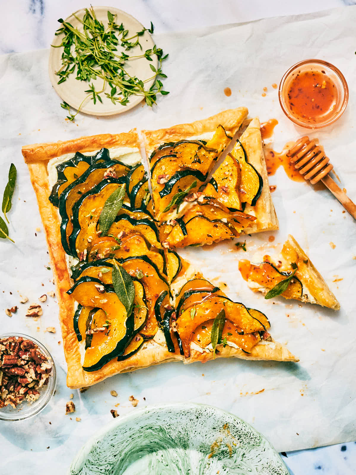 Roasted squash tart with puff pastry sliced for serving.