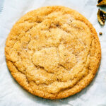 The best soft and chewy cardamom cookie on parchment paper.