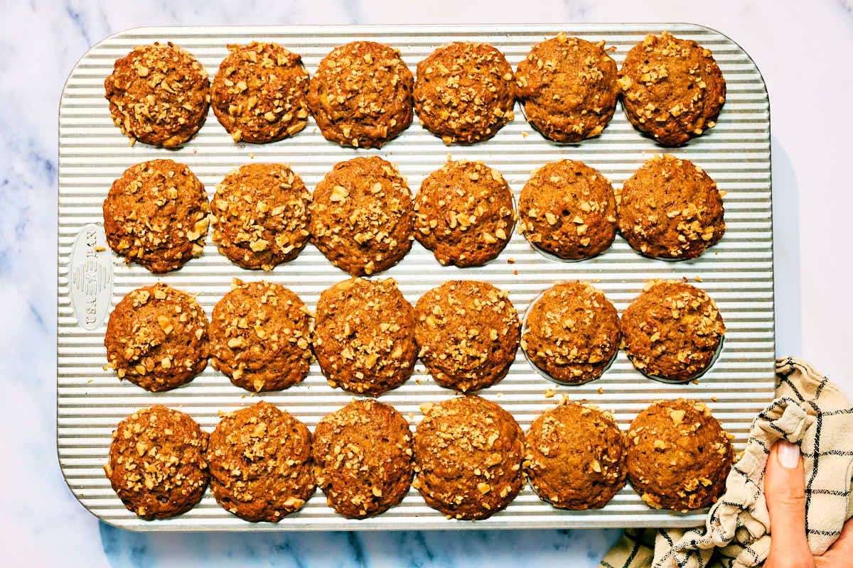 Banana Nut Bread Mini Muffins in a muffin tin after baking.