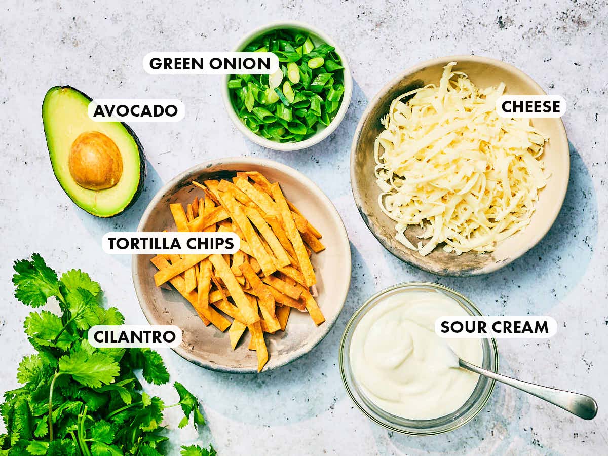 Toppings ideas for vegetarian chili, including avocado, tortilla chips, cheese.