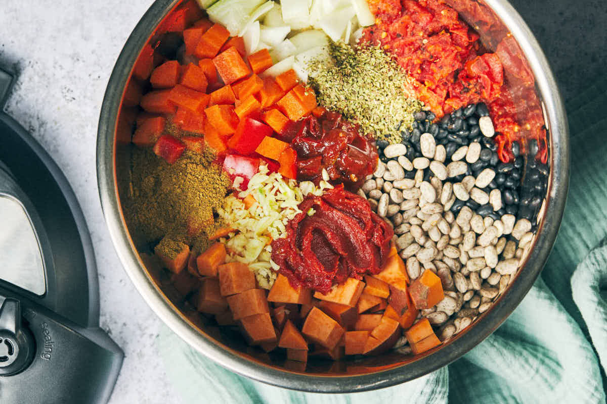 All the ingredients to make easy vegetarian chili in an Instant Pot before cooking.