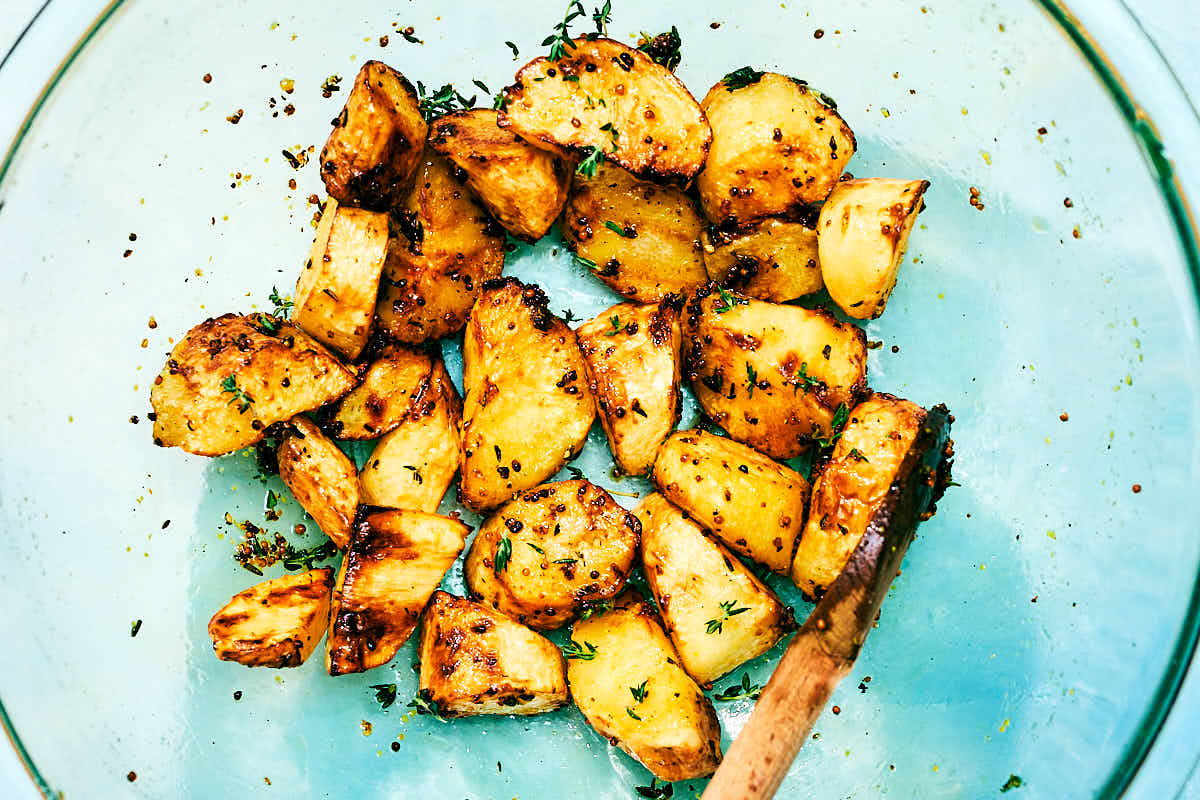 Roasted Air Fryer Parsnips with honey and thyme in a bowl.