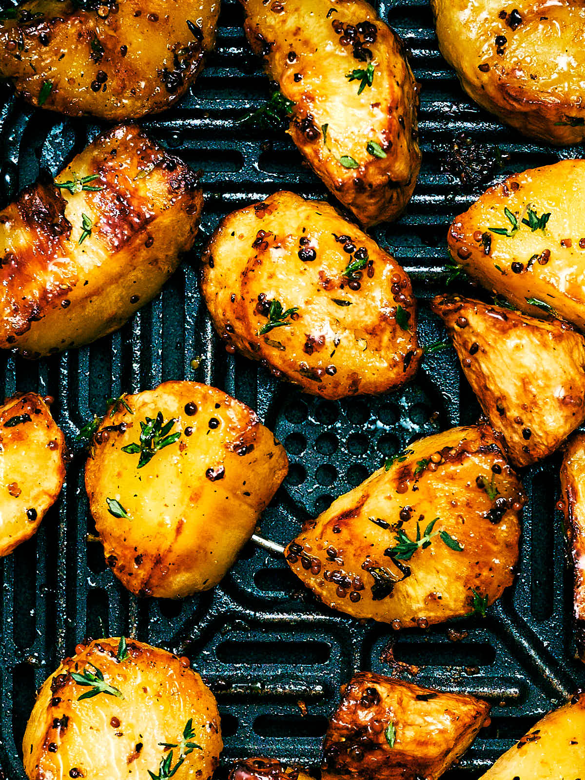Roasted Parsnips with honey in an Air Fryer basket.