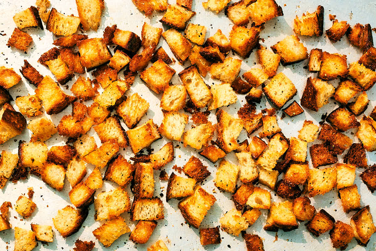 Oven baked croutons n a sheet pan.