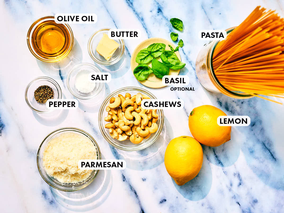 Ingredients to make lemon pesto pasta with cashews (or pine nuts).