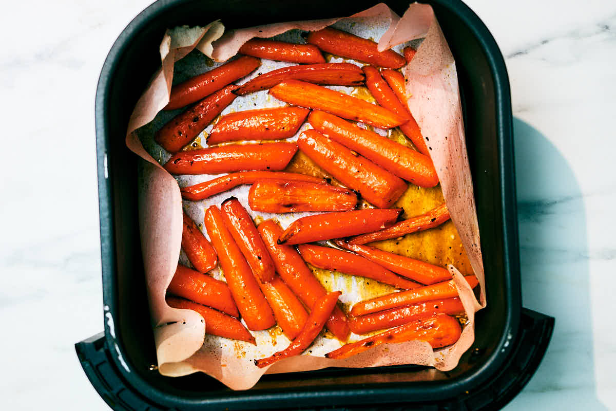 Honey Roasted Carrots in an air fryer basket after baking.