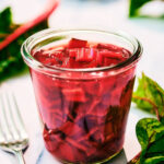 Quick Pickled Swiss Chard Stems in a glass jar.