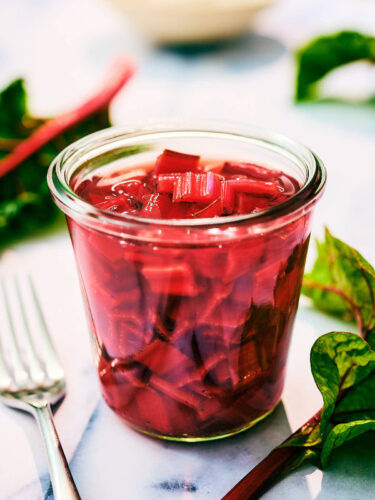 Quick Pickled Swiss Chard Stems in a glass jar.
