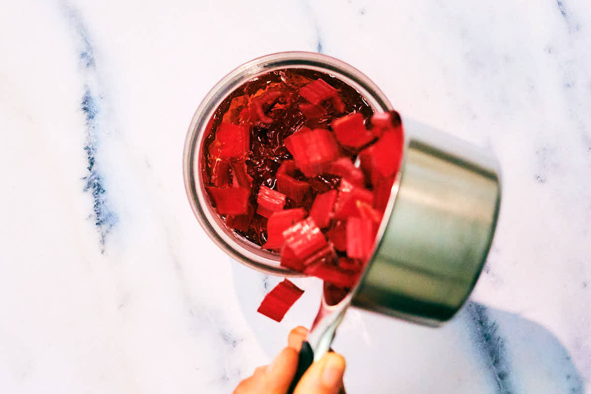 Swiss Chard stems being added to vinegar to quick pickle.