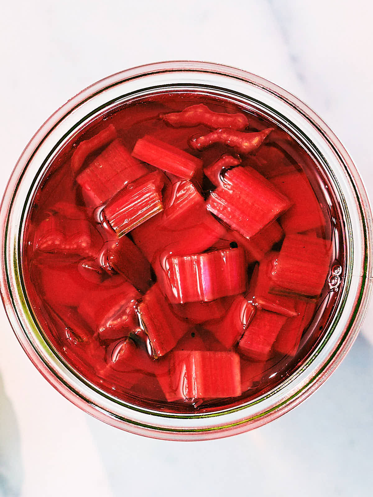 Homemade Quick Pickled Swiss Chard Stems in a glass jar.
