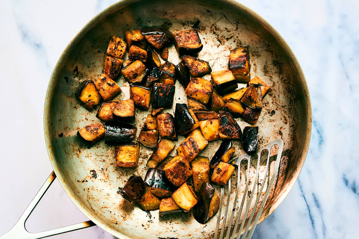 Seared eggplant in a skillet for Gochujang Pasta.