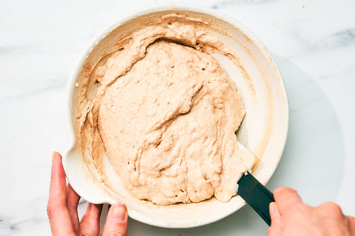 High protein cottage cheese pancake batter being mixed in a bowl.