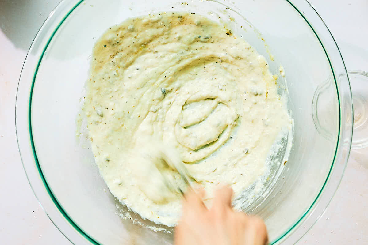 Greek Yogurt Caesar Salad Dressing (without anchovies, egg, mayo) being whisked in a bowl.