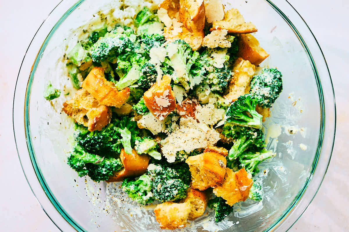 Broccoli Caesar Salad with croutons in a serving bowl.