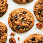 Chocolate Chip Pecan Cookies on parchment paper.