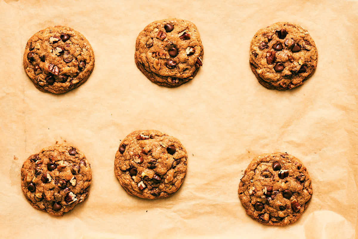 Evergreen Kitchen's soft Chocolate Chip Pecan Cookies on parchment paper.
