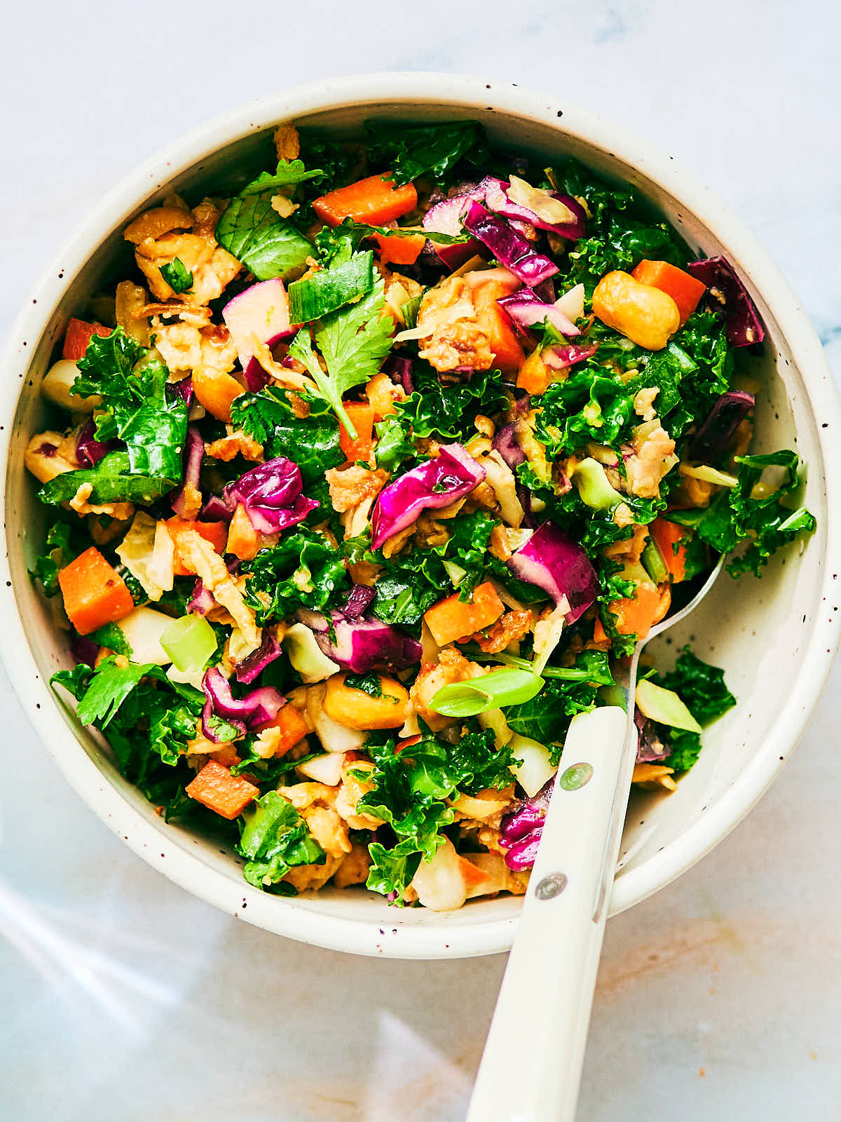 High Protein Asian Crunch Salad with peanut tofu in a bowl.