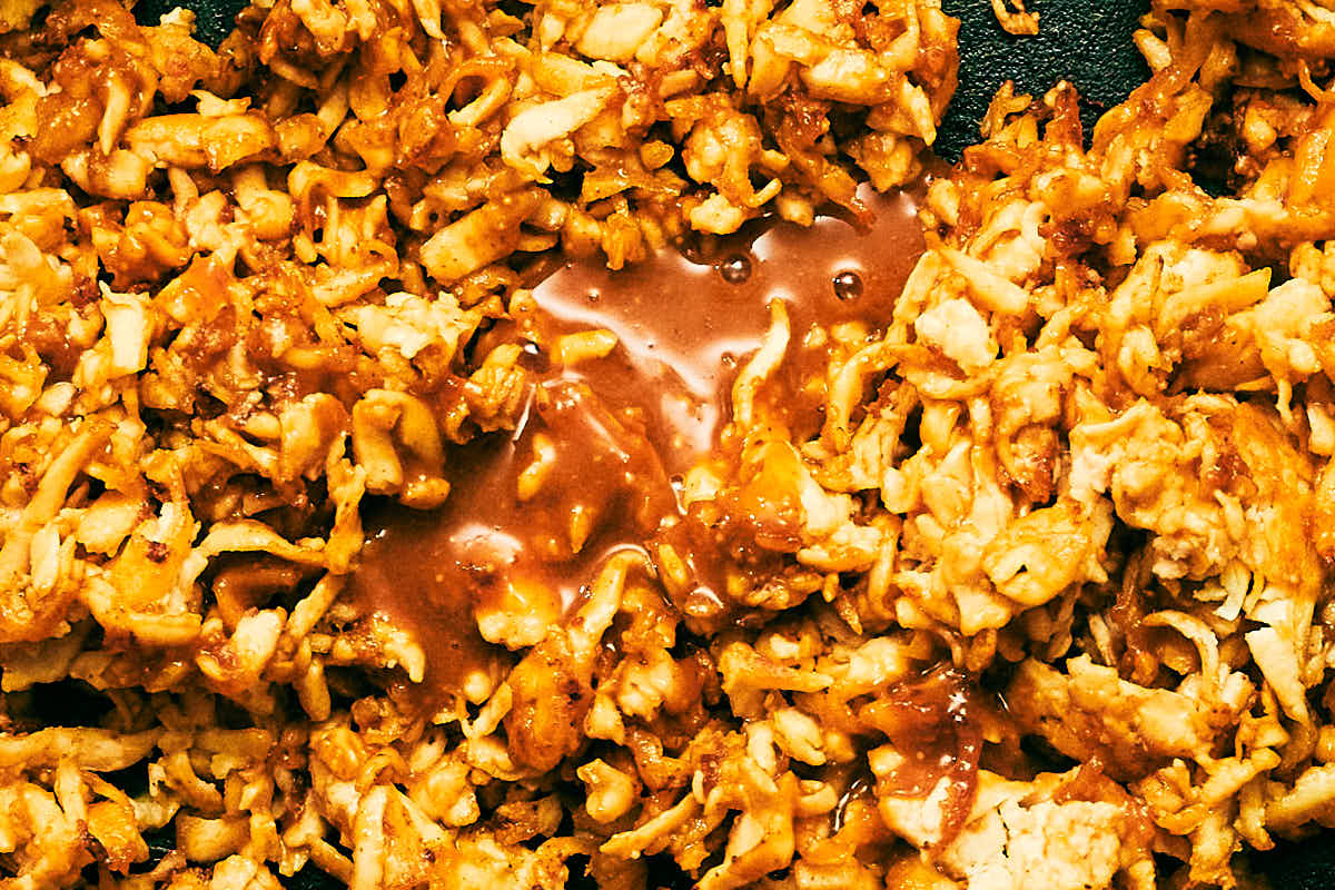 Peanut dressing poured over crisp shredded tofu.
