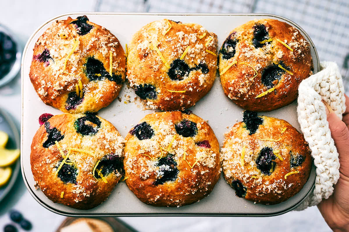 Evergreen Kitchen's Blueberry Cottage Cheese Muffins in a muffin tin.