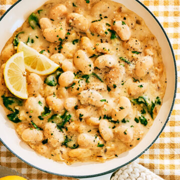 High Protein Creamy Lemon Butter Beans with Cottage Cheese in skillet.