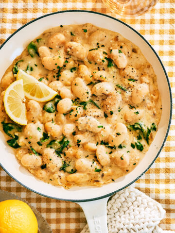 High Protein Creamy Lemon Butter Beans with Cottage Cheese in skillet.