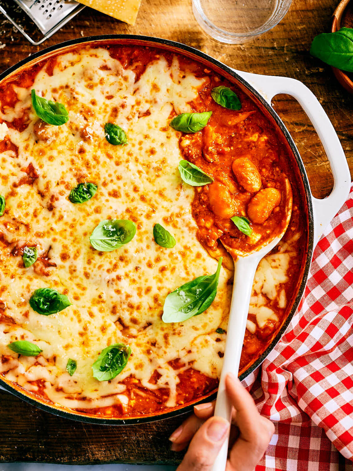 Evergreen Kitchen's vegetarian high protein Pizza Beans in a skillet, topped with basil.