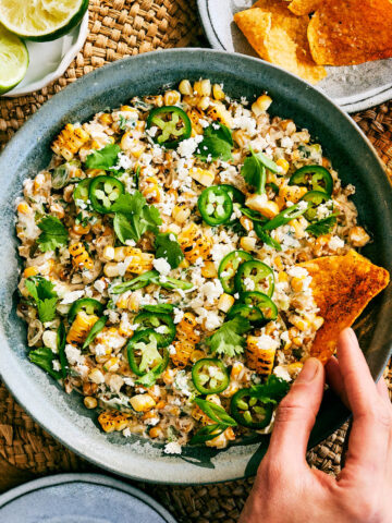 Evergreen Kitchen's Street Corn Dip with Cottage Cheese in a bowl with tortilla chips.