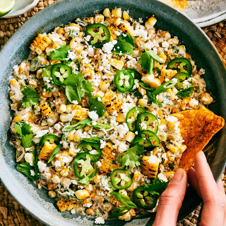 Evergreen Kitchen's Street Corn Dip with Cottage Cheese in a bowl with tortilla chips.