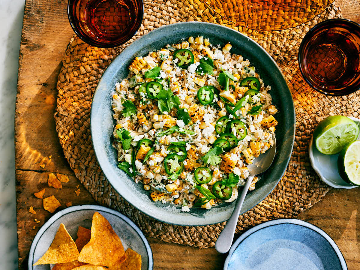 High protein Street Corn Dip with Cottage Cheese in a serving bowl on a table.