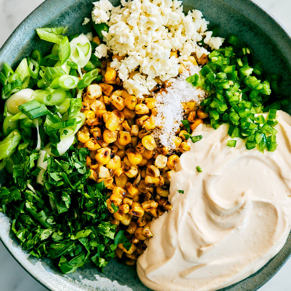 Ingredients for Street Corn Dip with Cottage Cheese in a bowl.