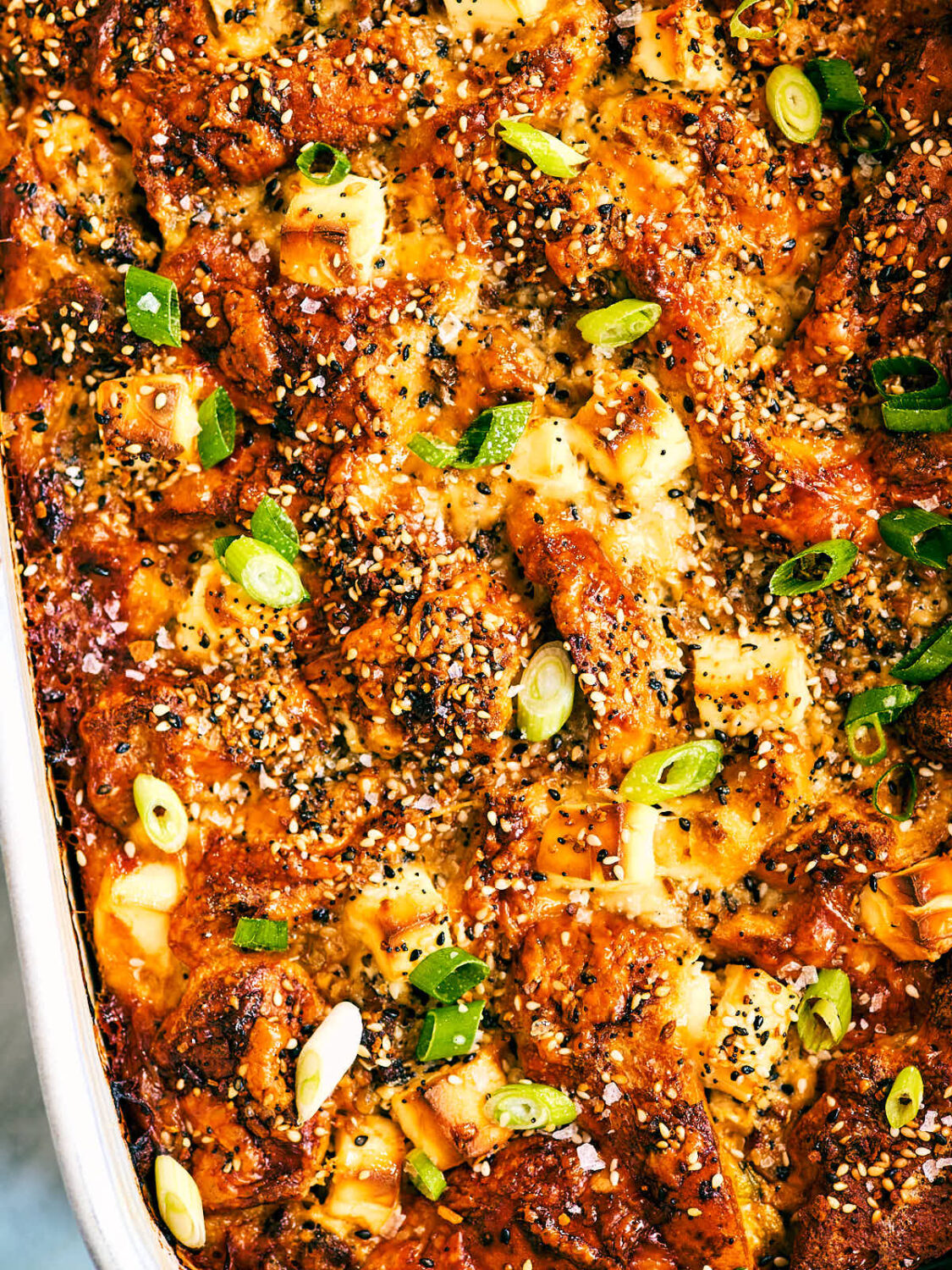 Vegetarian Bagel Breakfast Casserole with everything bagel spice and scallions.