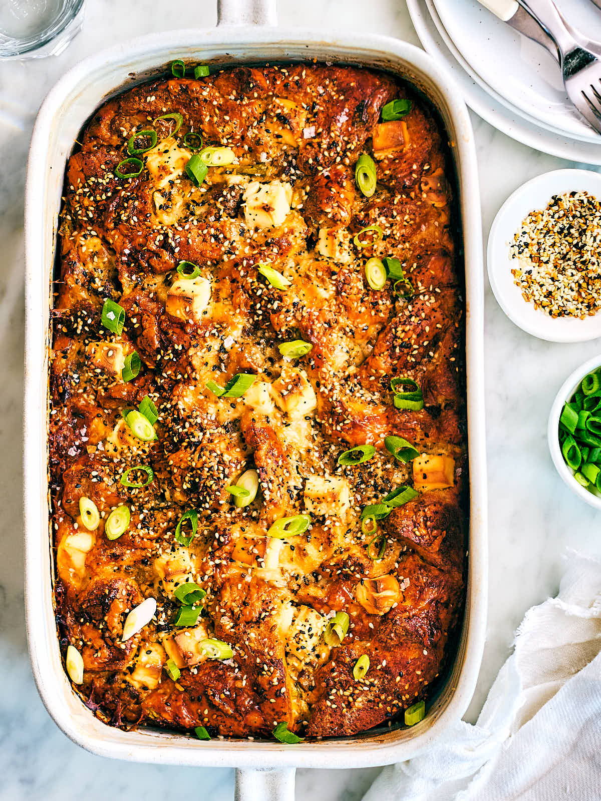 Evergreen Kitchen's vegetarian bagel breakfast casserole with scallions and cream cheese.