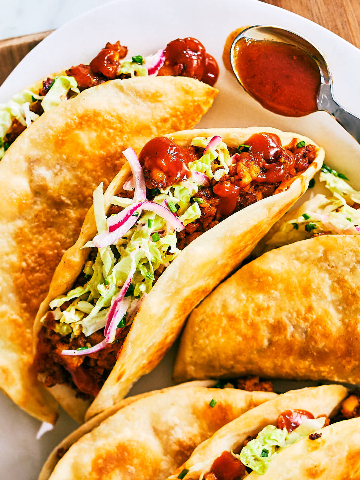 Vegan Sheet Pan Tacos with crispy tofu, barbecue sauce, and cabbage slaw.