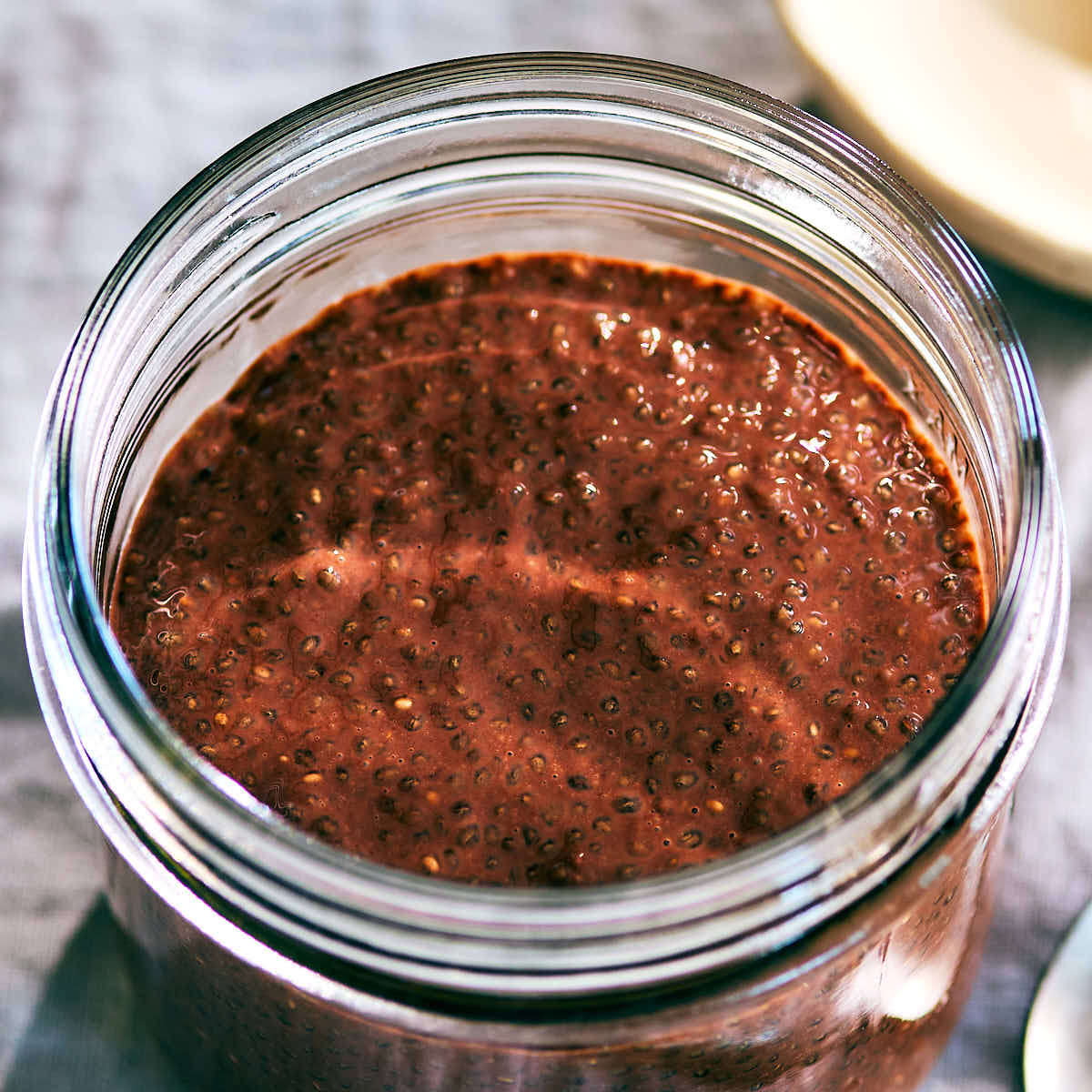 Chocolate Chia Pudding in a glass jar.
