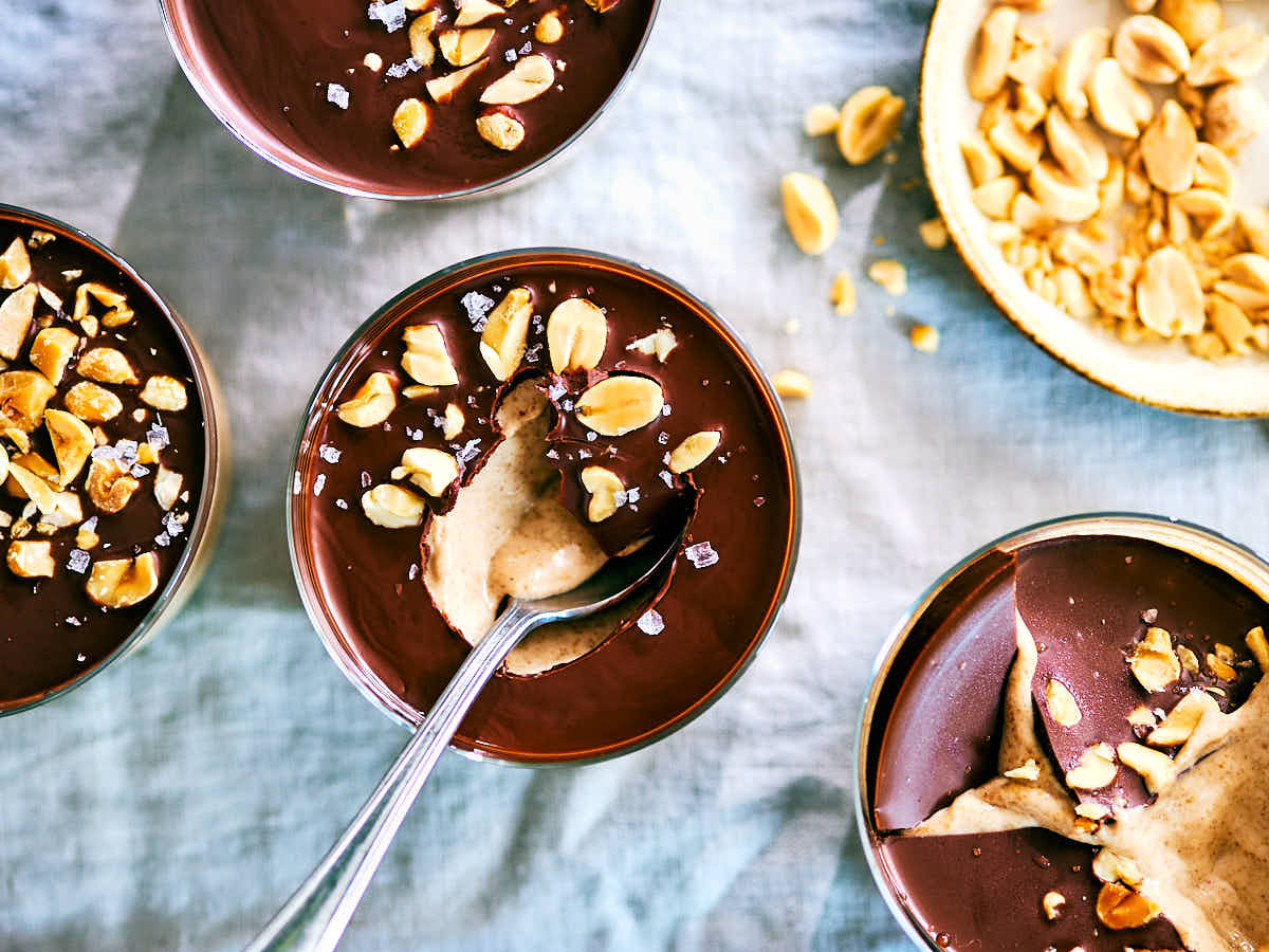 Peanut Butter Cup Chia Pudding topped with chocolate and peanuts.