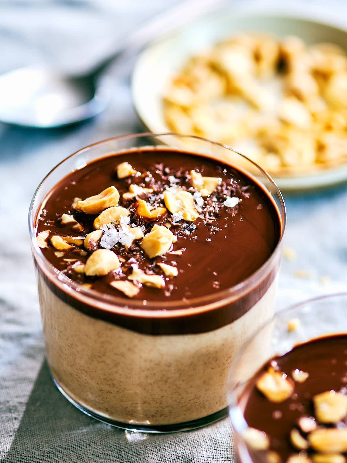 High protein Peanut Butter Cup Chia Pudding topped with chocolate and peanuts.