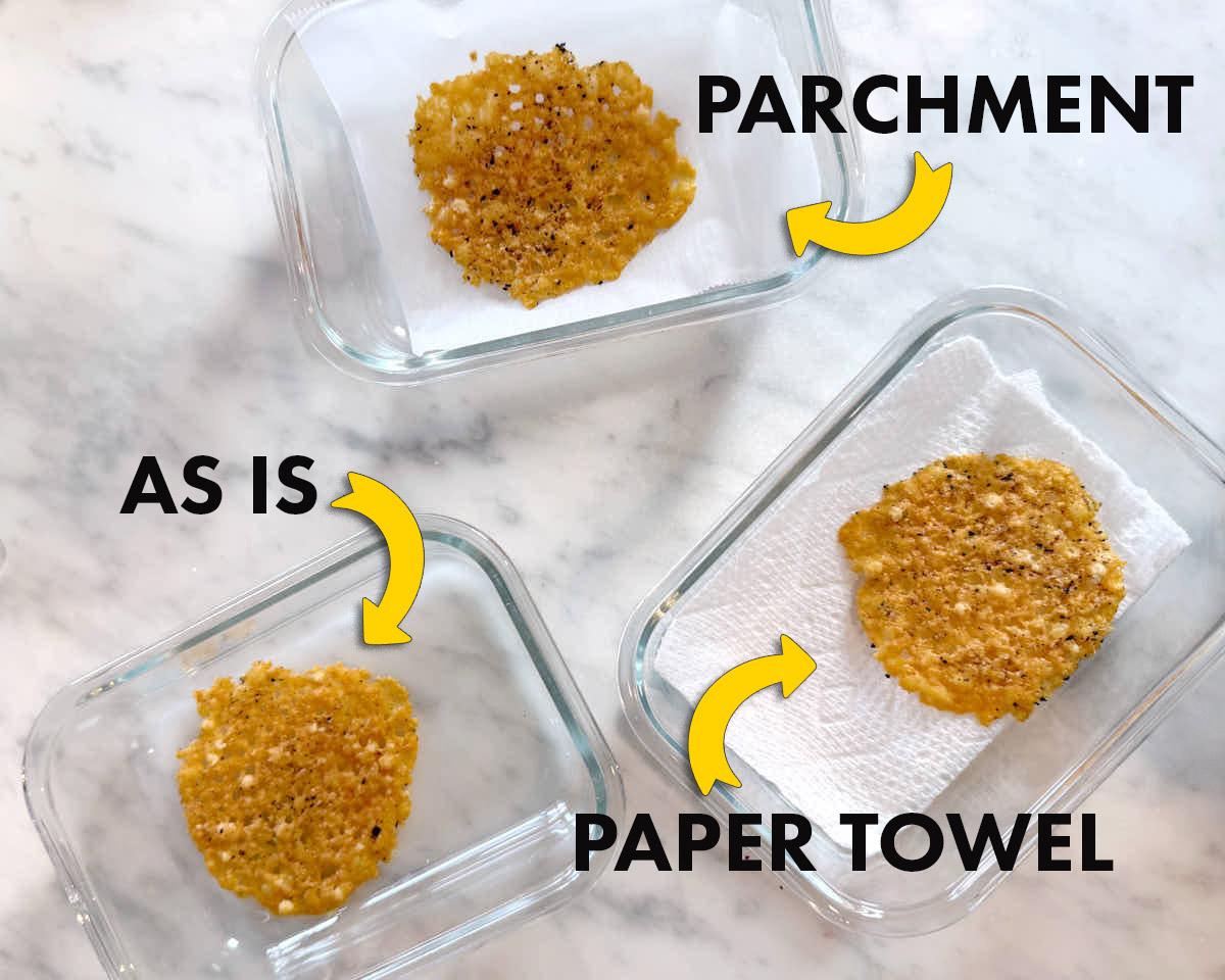 Parmesan crisps being stored in glass containers on the counter—testing plain, paper towel and parchment lined.