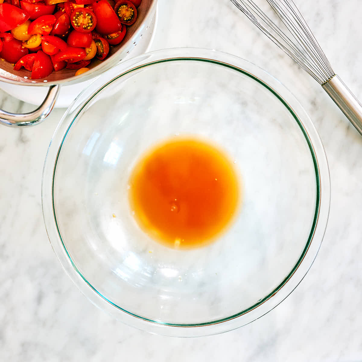 Tomato juices in a bowl, before being mixed into dressing.