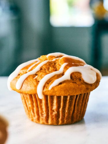 Pumpkin Protein Muffin with cottage cheese drizzled with cream cheese icing.